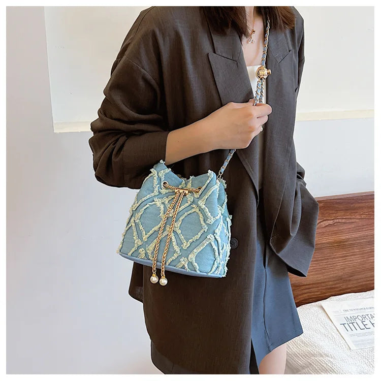 Vintage Denim Bucket Bag Retro Style Light Blue Ripped Edge Design Gold Chain Pearl Embellishment Adjustable Fringe Shoulder Bag