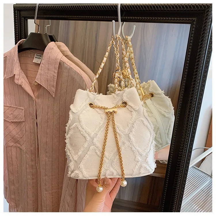 Vintage Denim Bucket Bag Retro Style Light Blue Ripped Edge Design Gold Chain Pearl Embellishment Adjustable Fringe Shoulder Bag