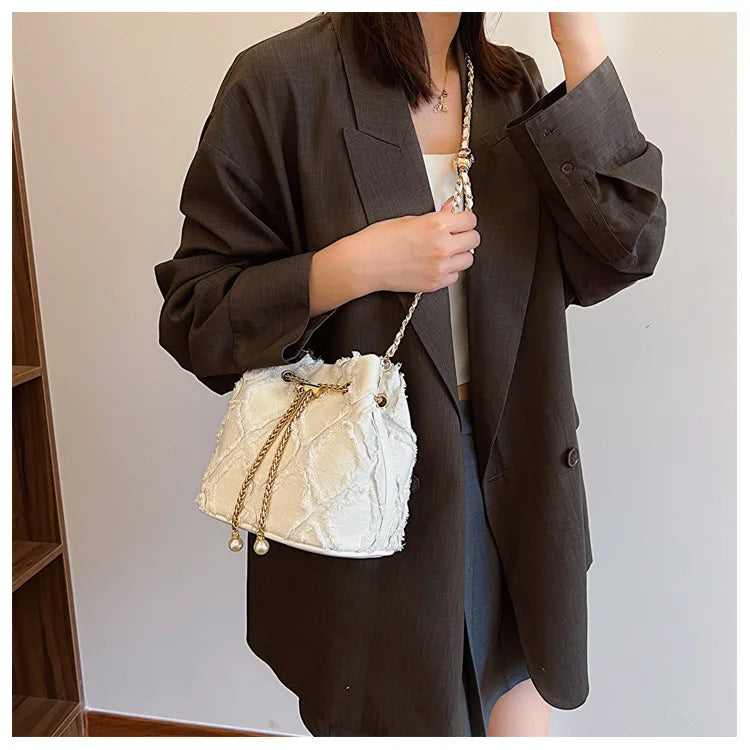 Vintage Denim Bucket Bag Retro Style Light Blue Ripped Edge Design Gold Chain Pearl Embellishment Adjustable Fringe Shoulder Bag