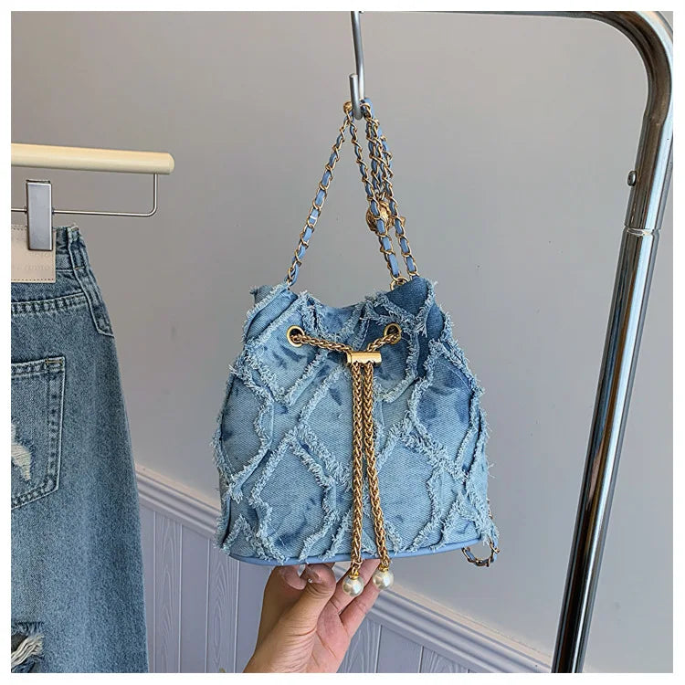 Vintage Denim Bucket Bag Retro Style Light Blue Ripped Edge Design Gold Chain Pearl Embellishment Adjustable Fringe Shoulder Bag