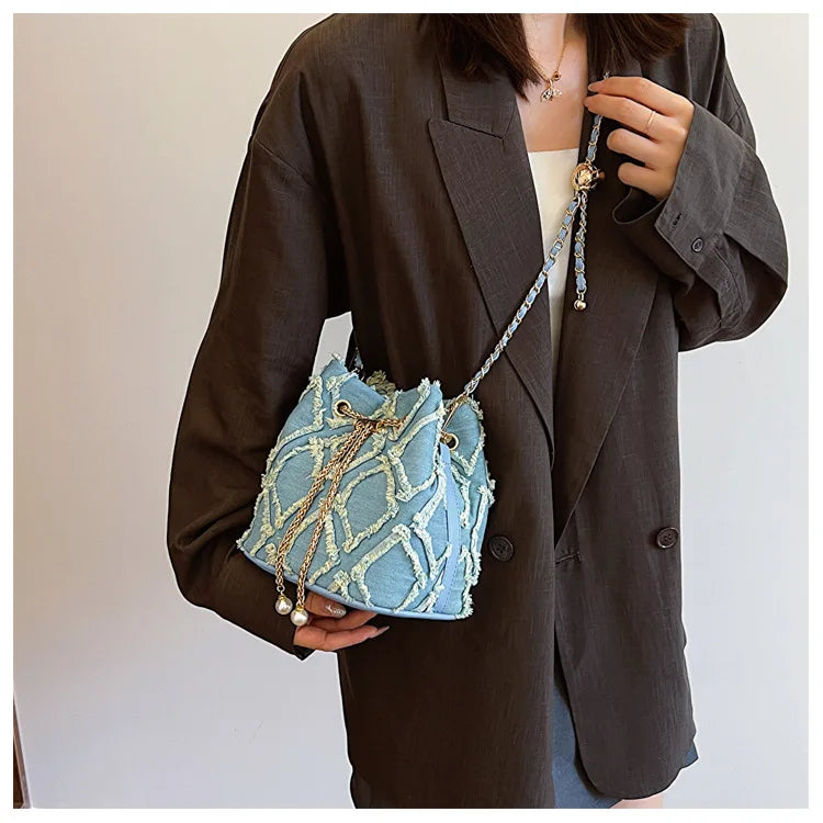 Vintage Denim Bucket Bag Retro Style Light Blue Ripped Edge Design Gold Chain Pearl Embellishment Adjustable Fringe Shoulder Bag