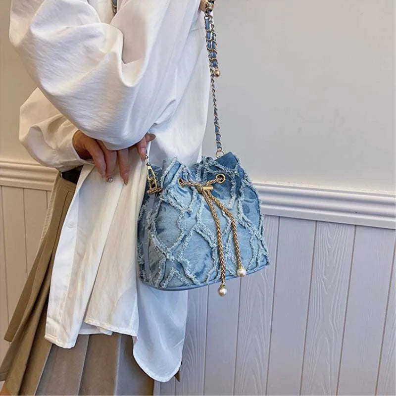 Vintage Denim Bucket Bag Retro Style Light Blue Ripped Edge Design Gold Chain Pearl Embellishment Adjustable Fringe Shoulder Bag