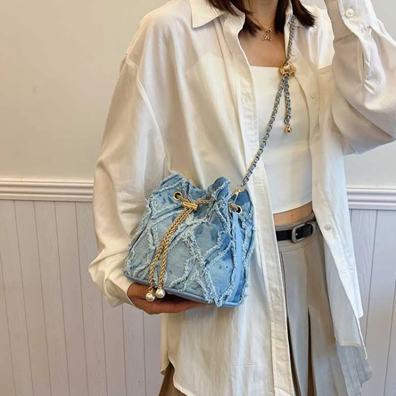 Vintage Denim Bucket Bag Retro Style Light Blue Ripped Edge Design Gold Chain Pearl Embellishment Adjustable Fringe Shoulder Bag