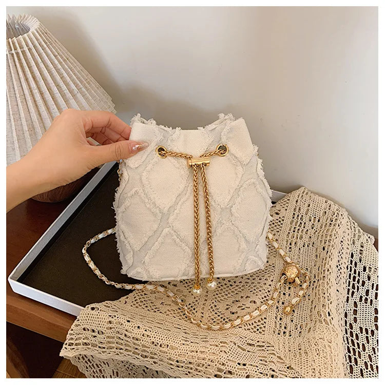Vintage Denim Bucket Bag Retro Style Light Blue Ripped Edge Design Gold Chain Pearl Embellishment Adjustable Fringe Shoulder Bag