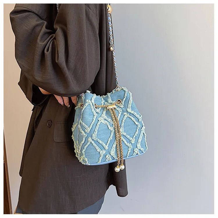 Vintage Denim Bucket Bag Retro Style Light Blue Ripped Edge Design Gold Chain Pearl Embellishment Adjustable Fringe Shoulder Bag