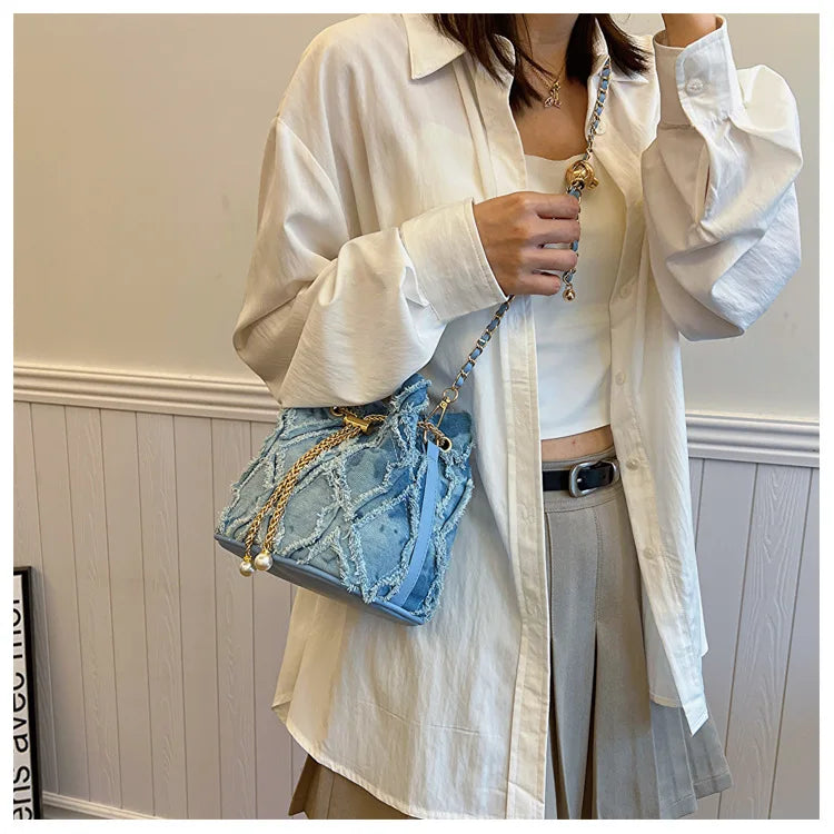 Vintage Denim Bucket Bag Retro Style Light Blue Ripped Edge Design Gold Chain Pearl Embellishment Adjustable Fringe Shoulder Bag