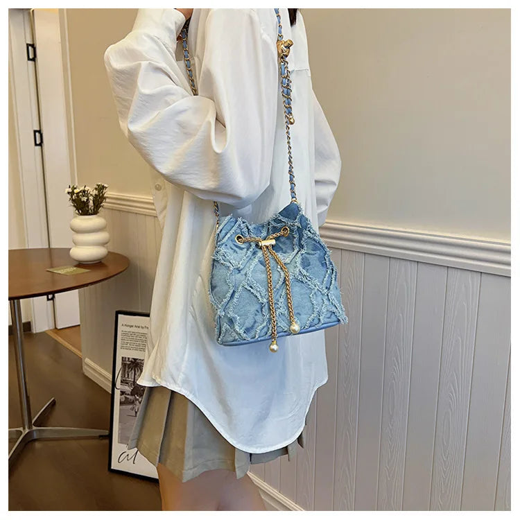 Vintage Denim Bucket Bag Retro Style Light Blue Ripped Edge Design Gold Chain Pearl Embellishment Adjustable Fringe Shoulder Bag