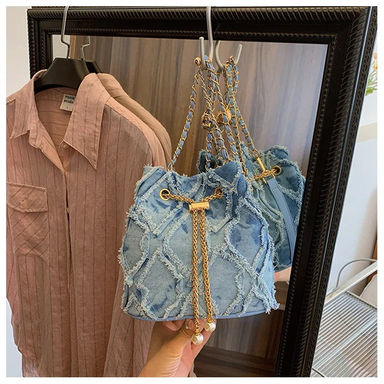 Vintage Denim Bucket Bag Retro Style Light Blue Ripped Edge Design Gold Chain Pearl Embellishment Adjustable Fringe Shoulder Bag