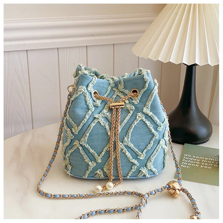 Vintage Denim Bucket Bag Retro Style Light Blue Ripped Edge Design Gold Chain Pearl Embellishment Adjustable Fringe Shoulder Bag