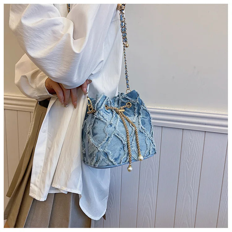 Vintage Denim Bucket Bag Retro Style Light Blue Ripped Edge Design Gold Chain Pearl Embellishment Adjustable Fringe Shoulder Bag